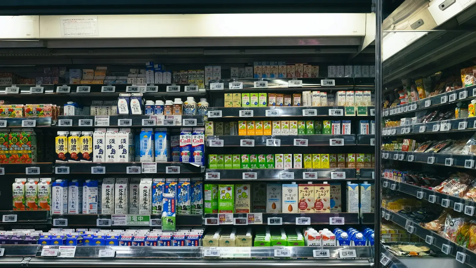 Supermarket shelves stocked with packaged food and drinks