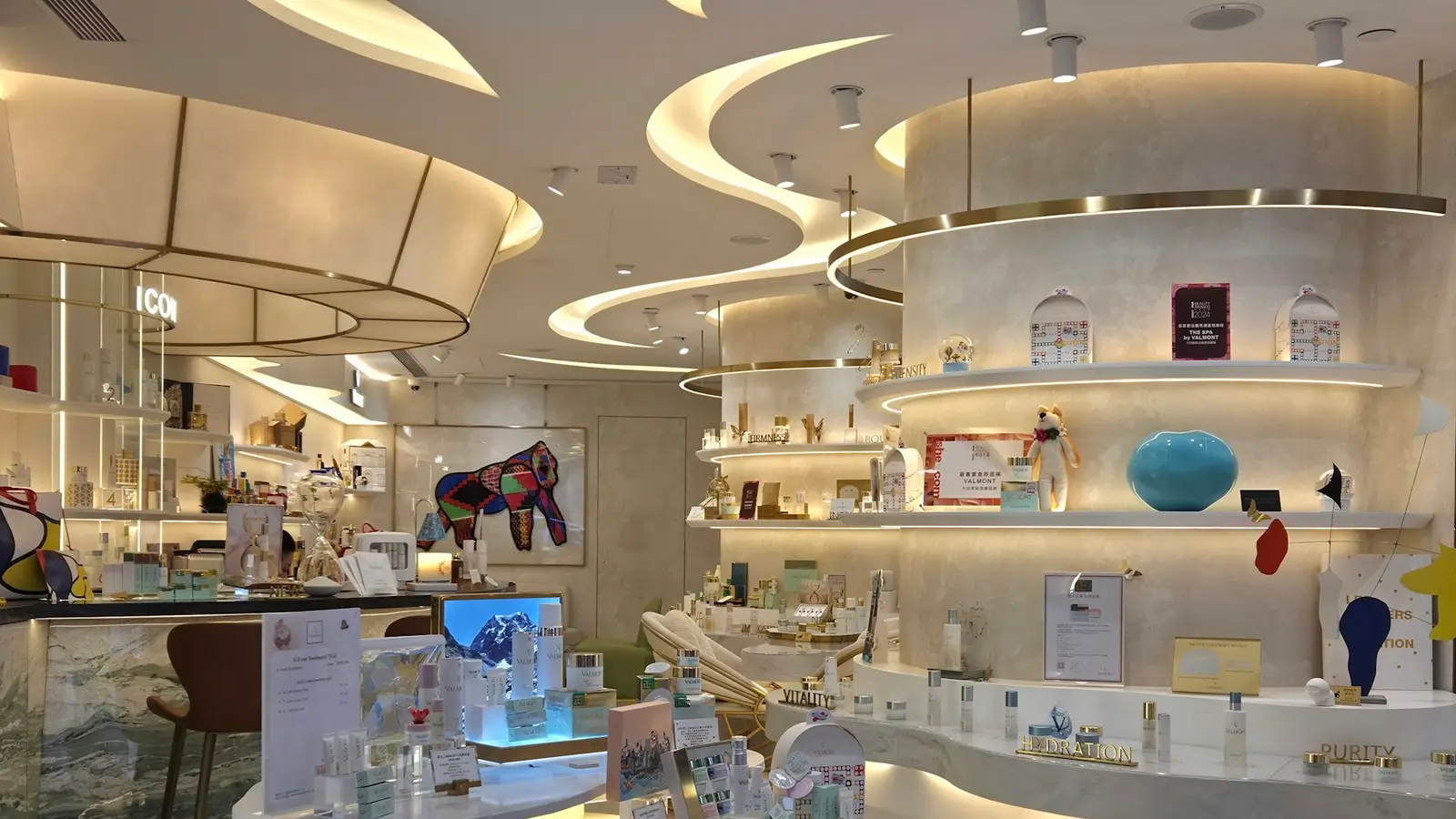 Skincare products on curved white shelves in a beauty store