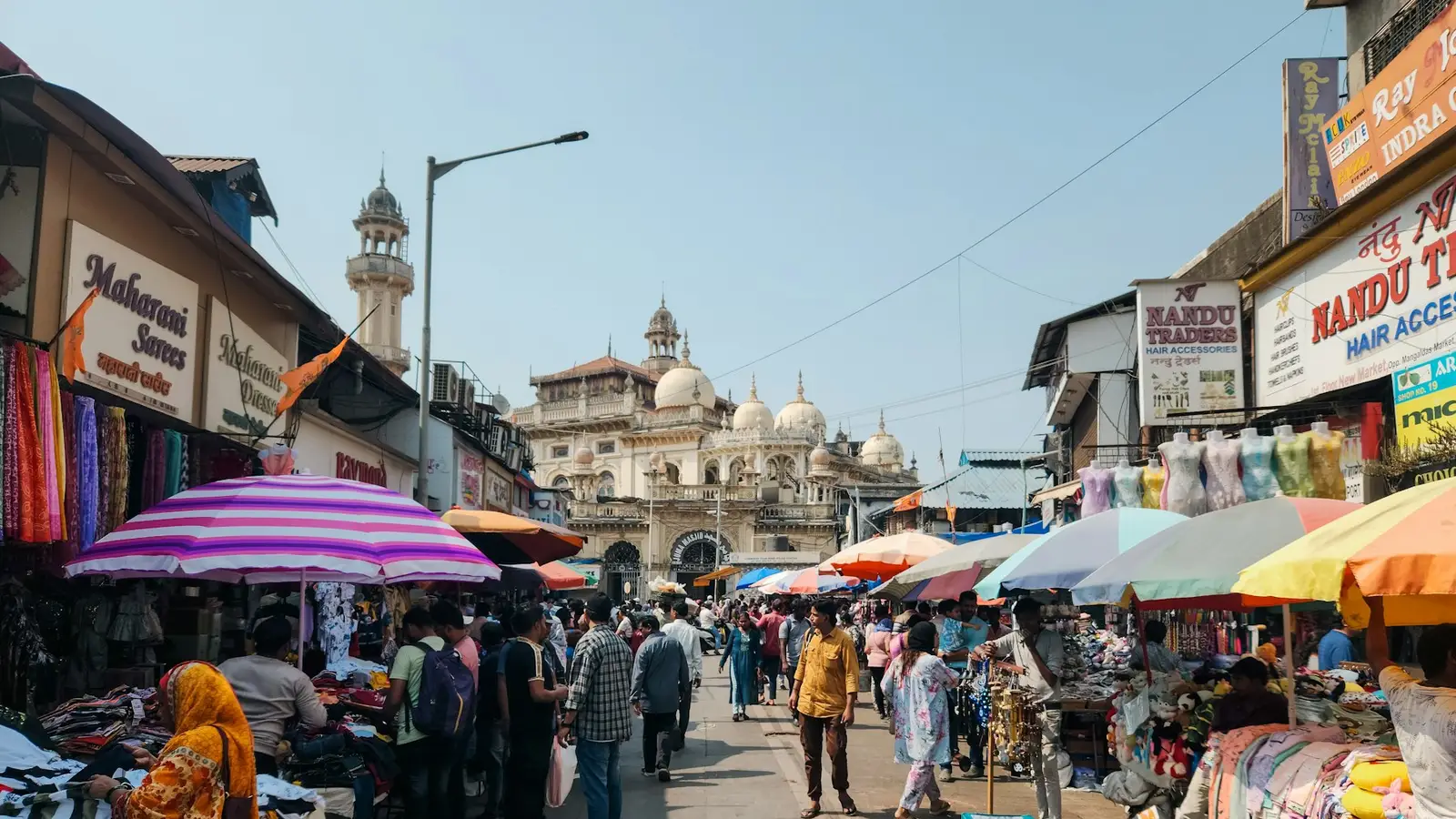 A busy wholesale market street lined with shops
